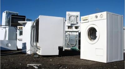 Different junk appliances are waiting in the parking lot to be removed by Jyr Junk Experts.