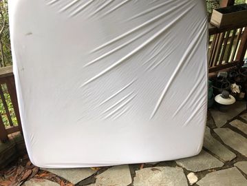 Old mattress awaiting pickup and disposal in San Francisco by JYR Junk Removal