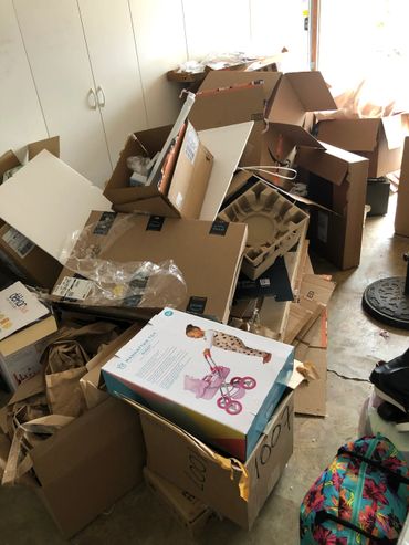 Cardboardboaex inside a garage