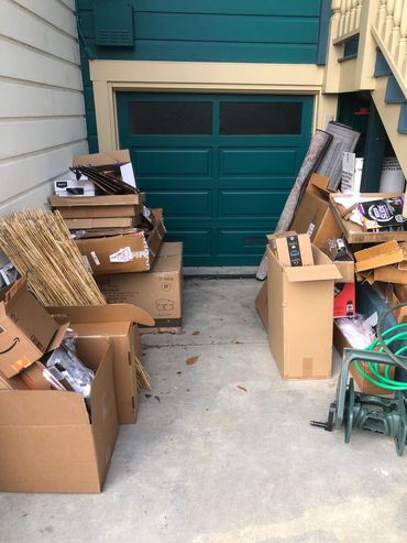 Cardboard boxes in front of a garage