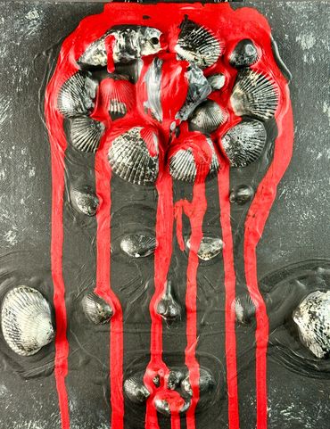 Shell artwork with red paint drips on black background.