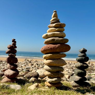 Balanced stones reflect integrative humanistic psychodynamic therapy approach UKCP psychotherapist