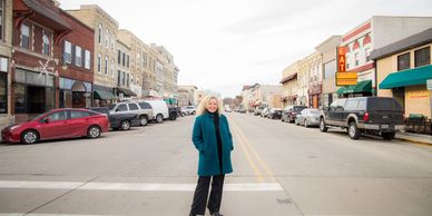Looking down Main Street in Whitewater, with Brienne Brown standing in the foreground.
