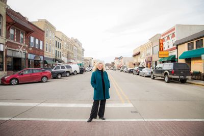 Looking down Main Street in Whitewater, with Brienne Brown standing in the foreground.
