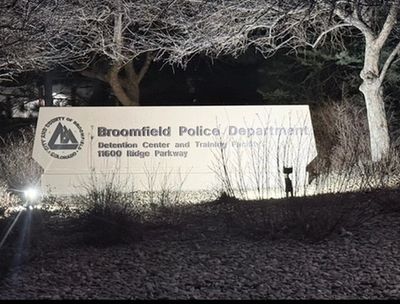 Signboard for Broomfield Police Department at night.