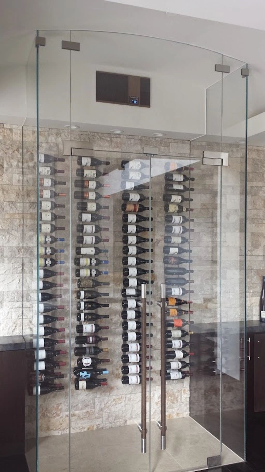 1/2" custom tempered glass wine room.  Temperature regulated.  Ultra Clear Low iron glass.