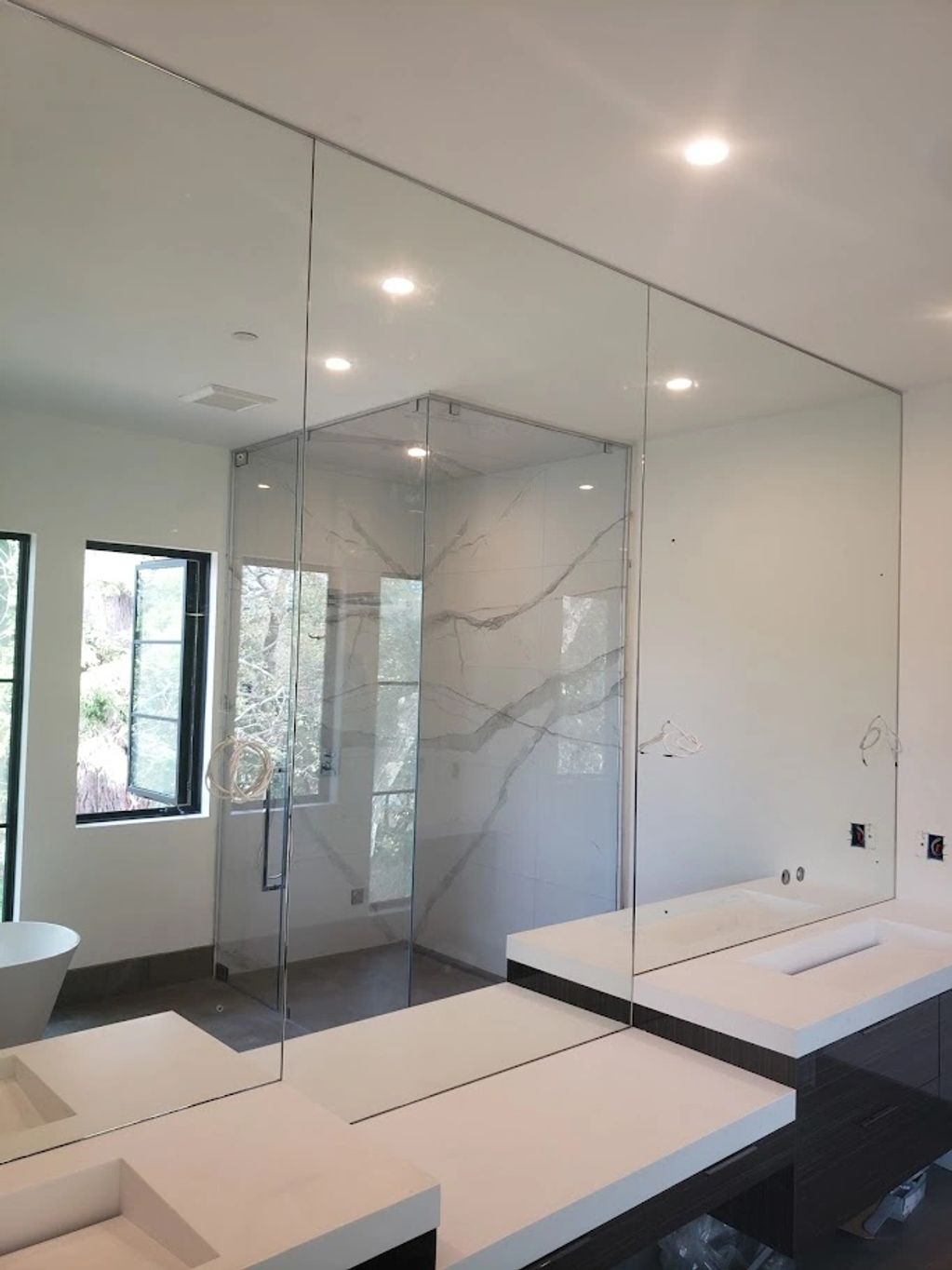 Custom glass mirror with holes and cutouts for lighting