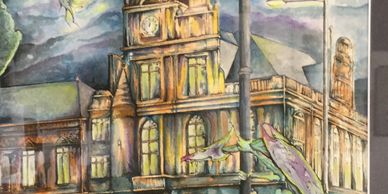 Fantasy watercolour of Great Yarmouth town hall at night with a street light and dragons.
