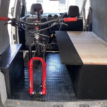 Mountain bike in the back of a van