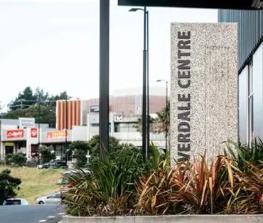 Signboard for Riverdale Centre outside a shopping area.