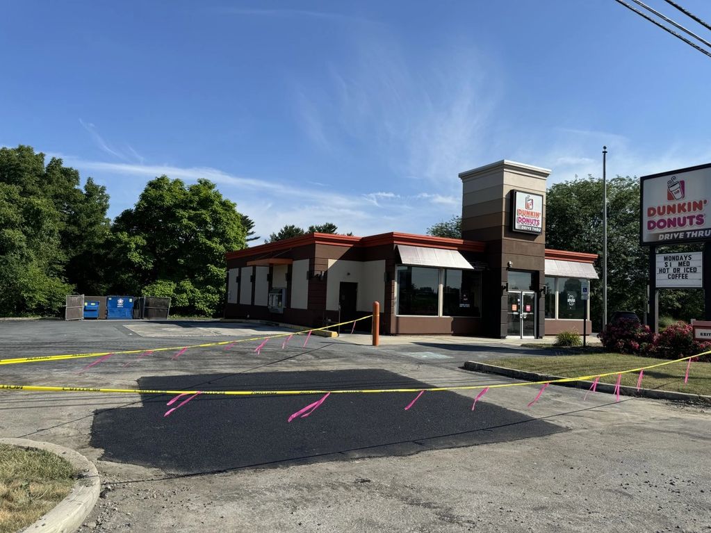 Dunkin' Donuts store with caution tape.