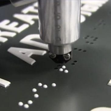ADA Sign being fabricated with Injected Braille
