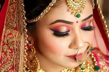 Close-up of a bride with elaborate makeup and traditional jewelry.