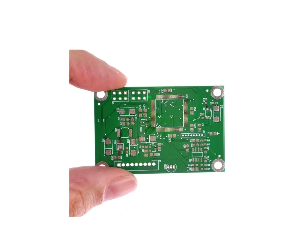 Hand holding a small green circuit board.