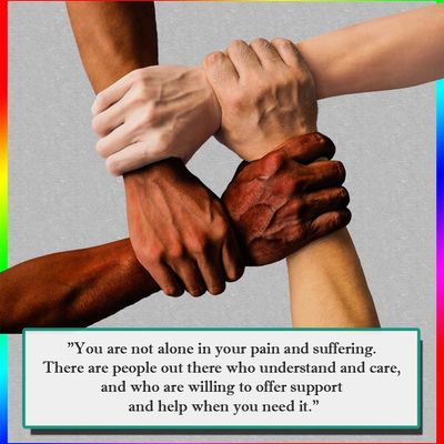 4 hands holding on at wrists to show support for one another.