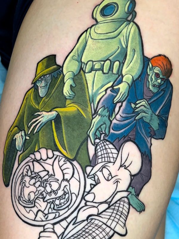 Colorful tattoo with cartoon characters and monsters in progress.