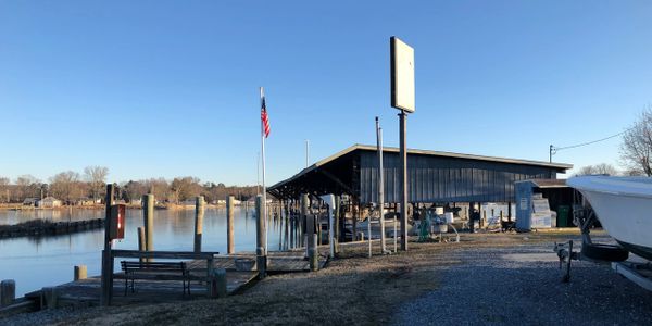 Covered boat slips and ethanol free fuel pump at Cather Marine Inc.