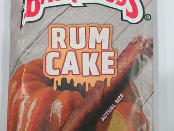 Package of rum cake with actual size illustration.