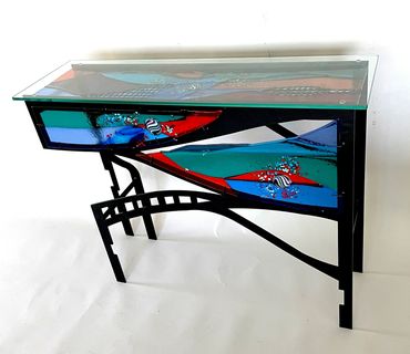 Title: Ocean Park
Dimensions: 30″ H, 40″ W, 12″ D
Fused Glass and Steel.