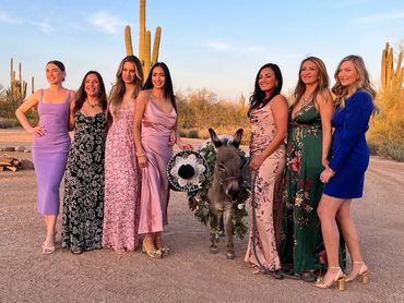Wedding cocktail hour beer burro guests pose for girls photo at desert foothills scottsdale Arizona