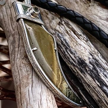 Custom necklace hand engraving around all sides. Jasper and sterling silver.