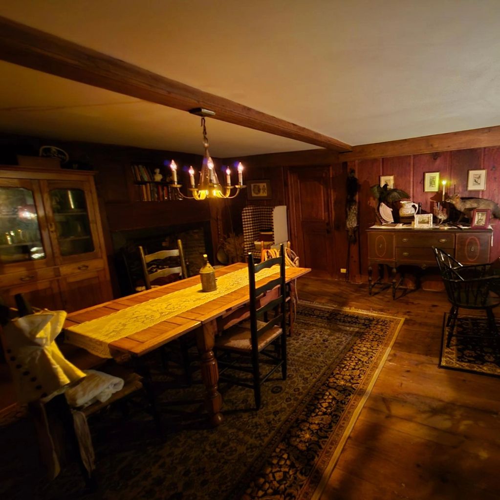 Dining room where guests can sit and eat breakfast play games, enjoy the fireplace of a colonial inn