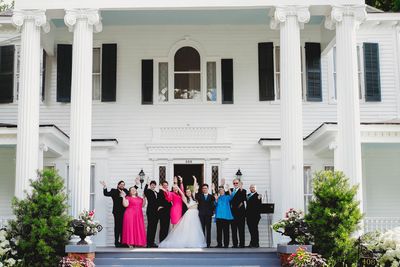Wedding party on veranda at Bauknight House.