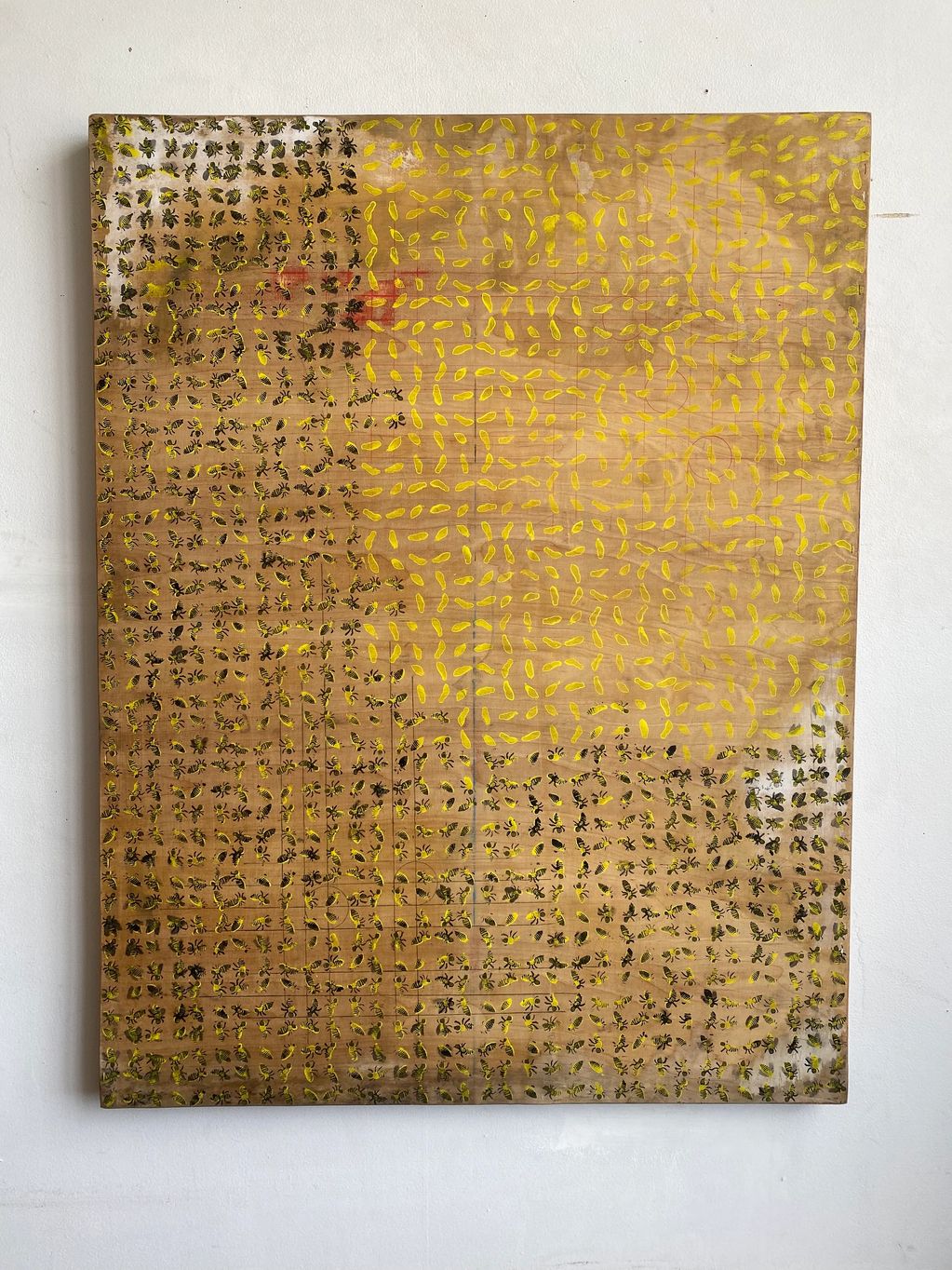 Abstract artwork featuring a grid of black ants and yellow shapes on a brown background.