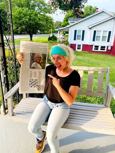Chasty King holding the Lincoln Times Newspaper
