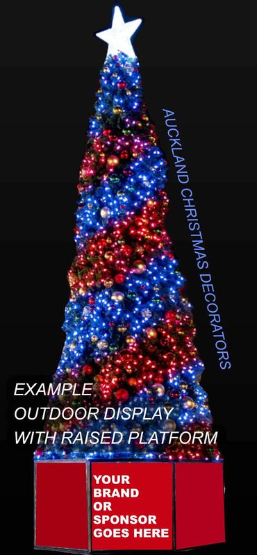 Example of an outdoor giant Christmas tree display with fancy colourful lights on a raised platform.