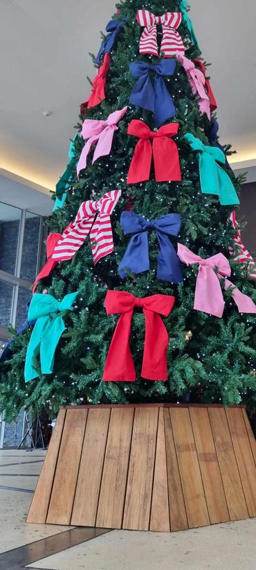 5m tall Christmas tree with cool white fairy lights and wooden tree collar at City Impact Church.
