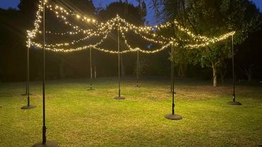 Outdoor light canopy (freestanding_ featuring commercial white fairy lights.