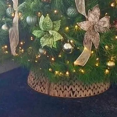 Closeup of natural material Christmas tree collar on one of our trees.