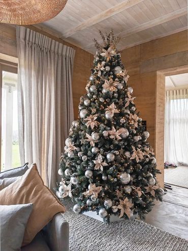Stylish and modern silver and champaign frosted Christmas tree design at Luxury Landing in Muriwai.