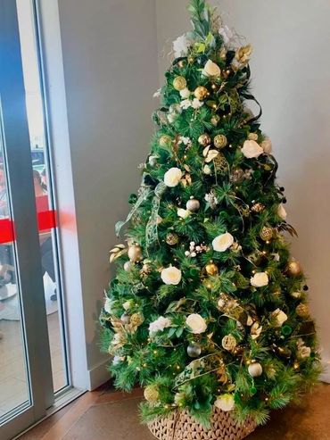 Ribbon and rose Christmas tree at staff Christmas party for big name cosmetic company.