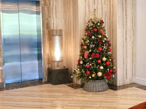 Luxury 7 foot vintage style Christmas tree with glass and tin ornaments on realistic pine - closeuo.