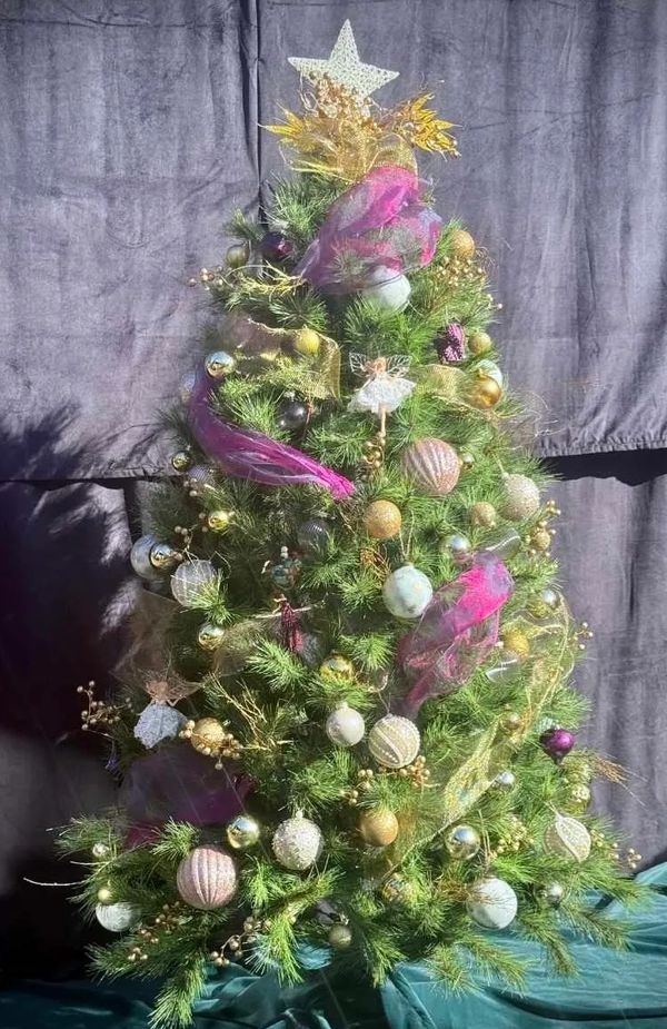 Realistic 5 foot Christmas tree with two toned gold and purple ribbons, fancy baubles & gold twigs.