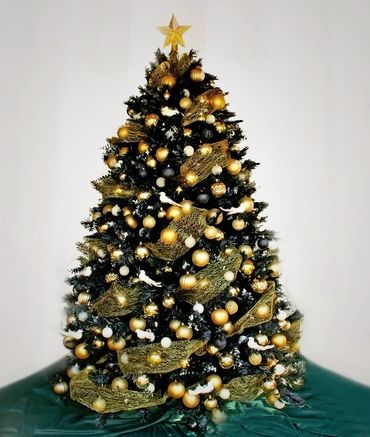 White and gold dove Christmas tree with black artificial pine tree.
