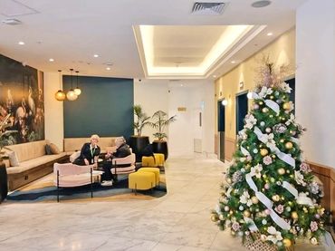 Blush pink and white floral Christmas tree at CBD hotel in Auckland city.