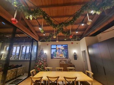 Made to measure fairy light curtain and Christmas decorations at Mt Eden apartment in Auckland.