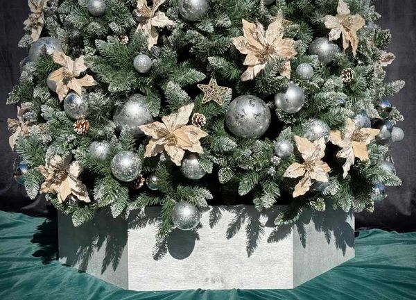 Closeup of Christmas tree base with silver painted wooden hexagon for silver & floral Christmas tree