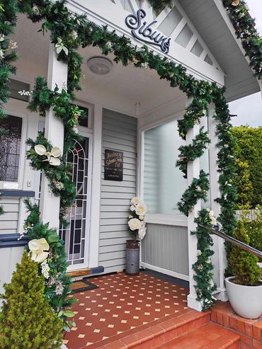 Christmas garland and lights outside large house for event and general decor.