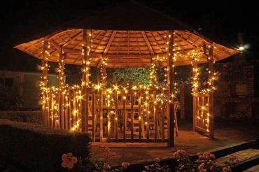 Commercial grade fairy lights in warm white on gazebo.