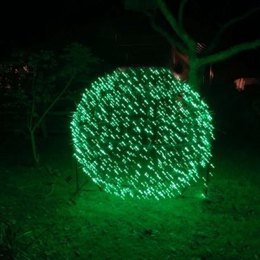 Green fairy lights on our giant light sphere.