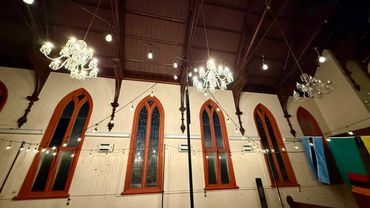 Indoorr fairy light canopy with black poles and commercial grade fairy lights in warm white.