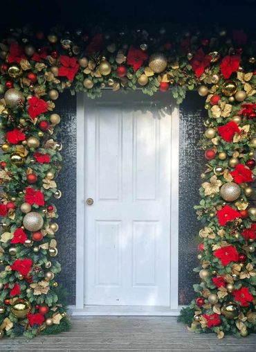 Lush entrance Christmas Garland door arch suitable for outdoors or indoors.