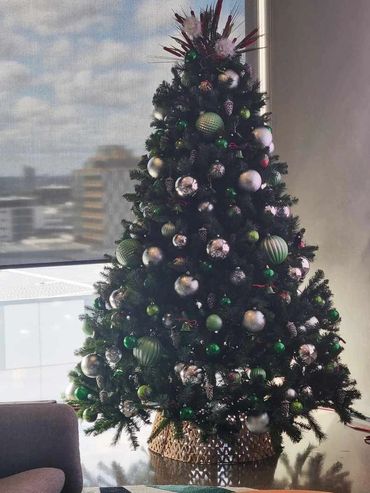 Silver and green Christmas decorations for corporate tree in Ponsonby office.