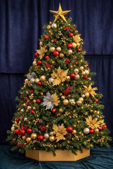 gold and red bauble spiral tree with touch of silver decorations and flowers + red berries.