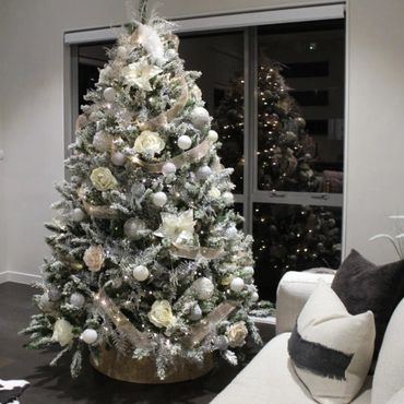 luxury white and peach Christmas tree in apartment.