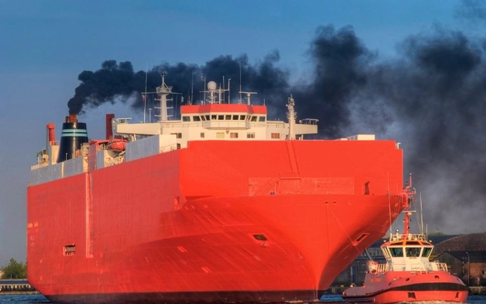 Cargo ship emitting toxic sulfur into the atmosphere.